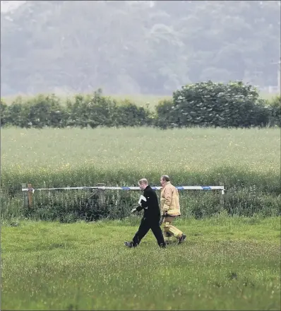  ?? PICTURE: JONATHAN GAWTHORPE. ?? TRAGEDY: Emergency services at the scene of the helicopter crash in Aldborough yesterday.