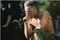  ?? MATIAS J. OCNER / MIAMI HERALD / TNS ?? XXXTentaci­on performs during the second day of the Rolling Loud Festival in downtown Miami in May 2017. Born Jahseh Dwayne Onfroy, the rapper died Monday at age 20.