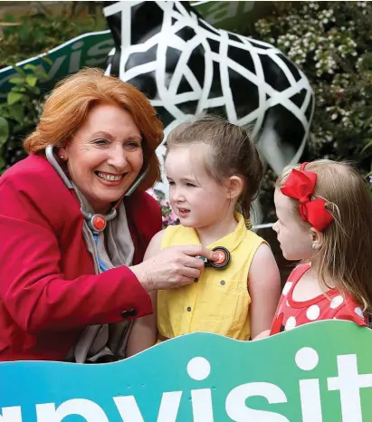  ??  ?? Primary and Social Care Minister Kathleen Lynch with Isabella Heapes (3) and Kiya O’Connor (4) from Macken Street, Dublin, at the launch of the online registrati­on system for the new free GP care for children under six