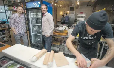  ?? JASON PAYNE/PNG ?? Mack Davis, left, and Braden Matthews are partners in Vital Supply Co., a food delivery service that places fridges in businesses filled with healthy foods.