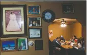  ?? (AP/David Goldman) ?? Mario Valdez, 62, (center) eats dinner with his wife, Reyna, 52, (right) and their son Axel, 18, at their home in Central Falls, R.I. The three were fully vaccinated for covid-19 this month as part of a special effort to inoculate every resident of Central Falls, R.I.