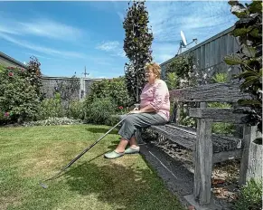  ?? PHOTOS: STACY SQUIRES/STUFF ?? Clare Scott says developing a flourishin­g new garden has required wisdom and realism over the past four years.
Main image: Keepsakes from Scott’s former Southland garden include a couple of rusty metal chooks.