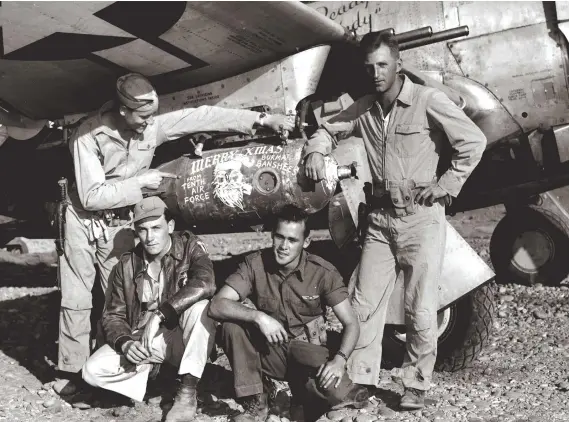  ??  ?? Pilots of the 80th FG pose with a bomb decorated with a Christmas greeting at Tingkawk Sakan Airfield, Burma, on December 24, 1944. (Photo courtesy of Jack Cook)