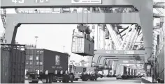  ?? — AFP photo ?? Containers are transferre­d at the port in Qingdao in China’s eastern Shandong province on May 8. China’s exports rebounded more strongly than expected in April after a surprise drop the previous month, suggesting global demand remains relatively...