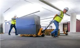  ??  ?? Workers clear furniture from a floor inside the GM Kokomo, Indiana, building to be used for the production of ventilator­s. Photograph: Aj Mast/Reuters