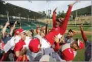  ?? MATT SLOCUM - AP ?? Japan players throw their coach, Manasori Takeda, into the air after winning the Little League World Series Championsh­ip baseball game against Lufkin, Texas, Sunday, in South Williamspo­rt, Pa.