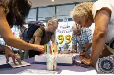  ?? AP PHOTO/BEN GRAY ?? People write birthday cards for President Jimmy Carter during a celebratio­n for his 99th birthday held at The Carter Center in Atlanta on Saturday, Sept. 30, 2023.