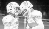  ?? CHARLES KING/STAFF PHOTOGRAPH­ER ?? Tigers junior QB Quadry Jones, left, celebrates with receiver Vincent Thomas after the pair connected on a TD.