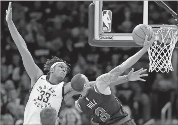  ?? Tony Dejak / AP ?? Cleveland’s George Hill (right) is fouled by Indiana’s Myles Turner in the second half of Sunday’s Game 7 in Cleveland.