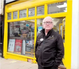  ??  ?? Brian McCormak, owner of Snappy Snaps, wants free parking for residents over Christmas to boost trade. Ref:133182-7