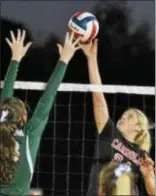  ?? BARRY TAGLIEBER — FOR DIGITAL FIRST MEDIA ?? Bishop Shanahan’s Tess Elder, left, and Archbishop Carroll’s Natalie Ogden vie for the ball above the net Saturday night at Jack Mancini Field.