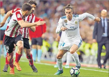  ?? AP ?? Real Madrid left Gareth Bale (right) on the bench till the final 20 minutes. Madrid got the equaliser against Athletic Bilbao in the 87th.