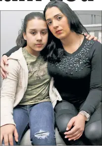  ??  ?? ORDEAL: Sophia Ceballos,11, with mom Catalina Robledo, grieves for Kokito (far left), who died in an overhead bin.