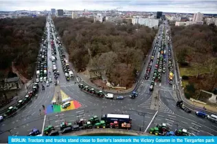  ?? ?? BERLIN: Tractors and trucks stand close to Berlin’s landmark the Victory Column in the Tiergarten park during a protest of farmers and truck drivers, on January 15, 2024 in Berlin. — AFP