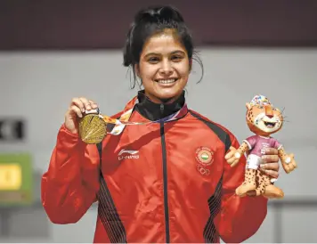  ?? GETTY IMAGES ?? Shooting star: Manu Bhaker with her 10m air pistol gold medal at the Buenos Aires Youth Olympics in October.