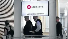  ??  ?? IN HOT SEAT: Shareholde­rs attend the Steinhoff annual meeting at the Cape Town Convention Centre as the storm rages over the company