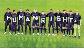  ?? AFP ?? Germany’s players pose for a group photo with the wording ‘Human rights’ on their T-shirts prior to the FIFA World Cup Qatar 2022 qualificat­ion football match against Iceland in Duisburg, western Germany, on March 25.