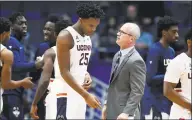  ?? Jessica Hill / Associated Press ?? UConn coach Dan Hurley talks with Josh Carlton (25) during the first half against New Hampshire on Saturday.