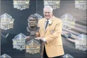  ?? GENE J. PUSKAR — THE ASSOCIATED PRESS, FILE ?? Former NFL player Mick Tingelhoff poses with his bust during the 2015 induction ceremony at the Pro Football Hall of Fame in Canton, Ohio.