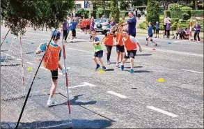  ?? Ioana Urzica / Contribute­d photo ?? Ukranian refugee children playing outdoors with the new equipment delivered thanks to a $5,000 donation from a fundraiser organized by Wilton’s Sean and Katherine Lentner.