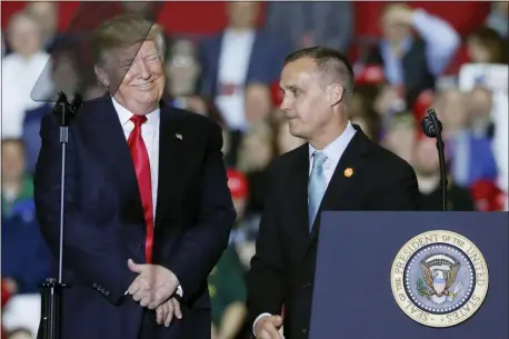  ?? PABLO MARTINEZ MONSIVAIS — THE ASSOCIATED PRESS ?? In this file photo, President Donald Trump, left, smiles after listening to Corey Lewandowsk­i, right, former campaign manager for Trump’s presidenti­al campaign, make remarks at a rally at Total Sports Park in Washington, Mich. Trump is throwing his support behind his former campaign manager, Corey Lewandowsk­i, who is considerin­g a run for Senate in his home state of New Hampshire.