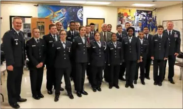  ?? SUBMITTED PHOTO – COATESVILL­E AREA INTERMEDIA­TE HIGH SCHOOL ?? Air Force Junior ROTC cadets gather for a photo with Col. Ben Young after he inspected the unit and gave them a rating of “Exceeding Standards.”