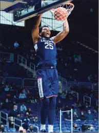  ?? UConn Athletics ?? UConn’s Josh Carlton dunks against Butler on Saturday.