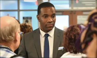  ?? ERIC BONZAR—THE MORNING JOURNAL ?? Newly appointed Lorain City School District CEO David M. Hardy Jr. speaks with the public following the Lorain Academic Distress Commission’s meeting announcing his hiring.