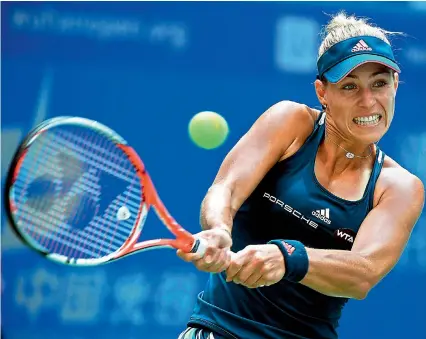  ?? — AFP ?? Angelique Kerber returns to Kristina Mladenovic in the opening round of the Wuhan Open on Tuesday. Kerber won 6-7, 6-1, 6-4.