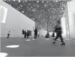  ?? Photo: IC ?? Visitors stroll across the central area of the Louvre Abu Dhabi at a preopening event on Tuesday.