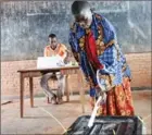  ?? AFP ?? A woman casts her vote at a polling station in Ciri, northern Burundi, on Thursday during a referendum on constituti­onal reforms.