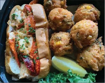  ?? (Arkansas Democrat-Gazette/Eric E. Harrison) ?? There was plenty of lobster in the Warm Buttered Lobster Roll from The Oyster Bar, and we got six hush puppies on the side.