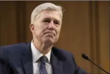  ?? ASSOCIATED PRESS ?? Supreme Court Justice nominee Neil Gorsuch listens as he is asked a question by on Capitol Hill in Washington on Wednesday during his confirmati­on hearing before the Senate Judiciary Committee.