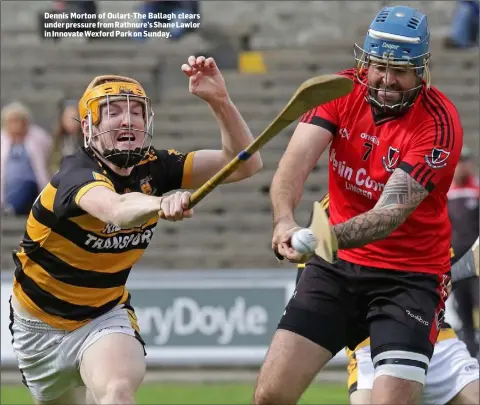  ??  ?? Dennis Morton of Oulart-The Ballagh clears under pressure from Rathnure’s Shane Lawlor in Innovate Wexford Park on Sunday.