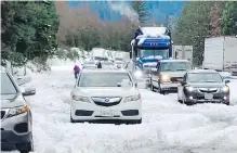  ??  ?? Traffic is stopped by heavy snow Wednesday on Interstate 5 near Dunsmuir, California.