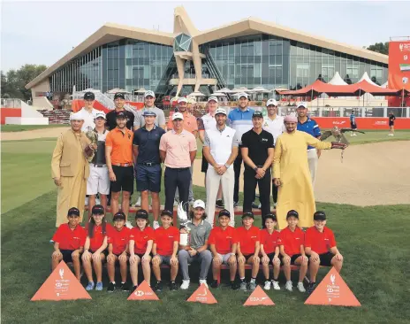  ?? Getty ?? The line-up for tomorrow’s Abu Dhabi HSBC Championsh­ip presented by EGA at the Abu Dhabi Golf Club, including – at centre of middle row in pink shirt – Brooks Koepka. The American won the US Open and US PGA Championsh­ip last season