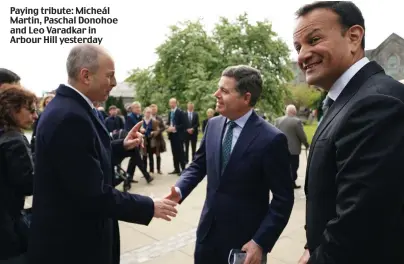  ?? ?? Paying tribute: Micheál Martin, Paschal Donohoe and Leo Varadkar in Arbour Hill yesterday