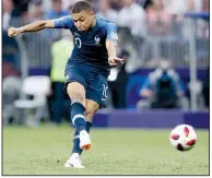  ?? AP/PETR DAVID JOSEK ?? ABOVE Kylian Mbappe scores France’s fourth goal during Sunday’s championsh­ip. Mbappe, 19, became only the second teen after Pele to score in a World Cup final.