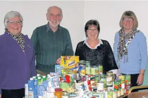  ??  ?? ●●Nigel Tedford from Stockport Foodbank with Crystal Chords committee members Kristina Mair, Jenni Brockis and Pat Gregory.