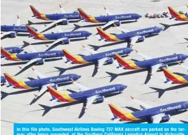  ??  ?? In this file photo, Southwest Airlines Boeing 737 MAX aircraft are parked on the tarmac after being grounded, at the Southern California Logistics Airport in Victorvill­e, California. — AFP