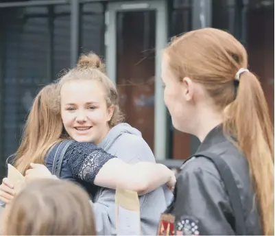  ??  ?? Pupils at St Anthony’s Girls’ Catholic Academy celebrate their GCSE results.