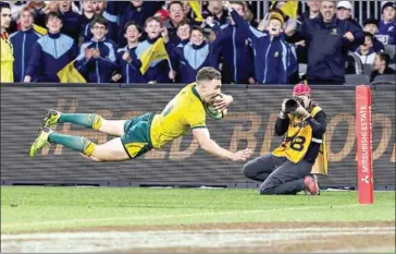  ?? AFP ?? Australia’s Nic White scores a try during the Rugby Championsh­ip Bledisloe Cup Test match in Perth on August 10, 2019.