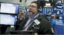  ?? RICHARD DREW — THE ASSOCIATED PRESS ?? Trader Michael Capolino works on the floor of the New York Stock Exchange, Tuesday.