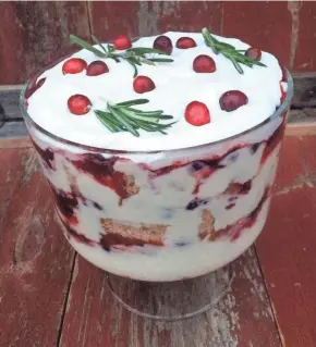  ?? ANNA THOMAS BATES ?? Cherry Spice Cake Trifle will wow your guests and help ring in a sweet New Year.