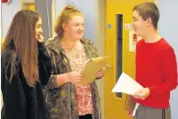  ??  ?? ●● Students Emily Lyons, Natasha Boden and Joseph Richardson compare results