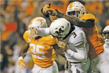  ?? STAFF PHOTO BY C.B. SCHMELTER ?? Tennessee linebacker Darrell Taylor hits Missouri quarterbac­k Drew Lock (3) and is called for roughing the passer during Saturday’s game at Neyland Stadium.