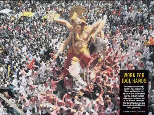  ??  ?? Devotees carry through the streets a huge idol of Hindu god Ganesha, the patron of arts and sciences and the deity of intellect and wisdom, for immersion in the Arabian Sea on the final day of the ten-day long Ganesha festival in Mumbai, India, yesterday.