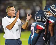 ?? STEPHEN DUNN/AP FILE PHOTO ?? UConn head coach Randy Edsall encourages his players during last year’s season opener against Central Florida at Rentschler Field in East Hartford. Despite two difficult seasons in his return to Storrs, Edsall is confident the Huskies are headed in the right direction.