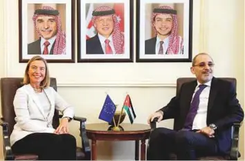  ?? Reuters ?? Federica Mogherini with Ayman Safadi in Amman yesterday. Mogherini said the EU will provide €20 million to Jordan.