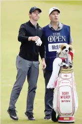  ?? — Reuters ?? Northern Ireland’s Rory McIlroy stands with his caddie JP Fitzgerald during the 146th Open Championsh­ip at Royal Birkdale.